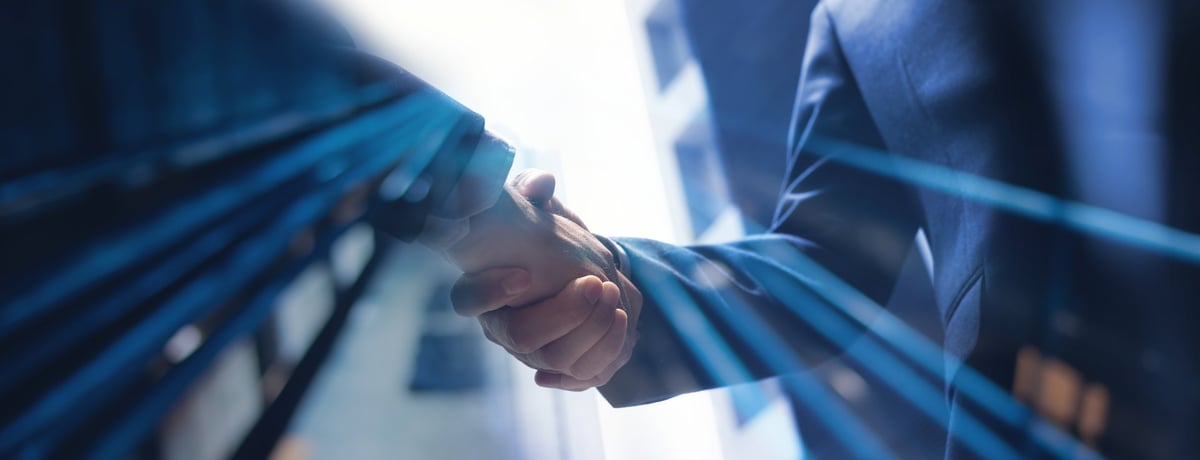 Business partnership handshake